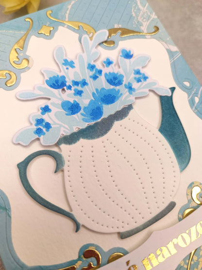 Světle modré narozeninové přání s konvičkou